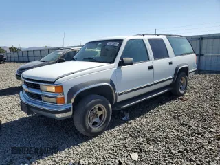 1999 Chevrolet Suburban with VIN 3GNFK16R4XG166468, listed as a Copart auction lot 63573865 with 176,658 mi miles and Salvage title. Bid and sale history available at DreamBid. Image 1.