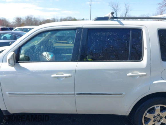2011 Honda Pilot Touring with VIN 5FNYF4H96BB014095, listed as a IAAI auction lot 41794052 with 202,440 mi miles and . Bid and sale history available at DreamBid. Image 14.
