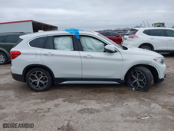 2019 BMW X1 xDrive28i with VIN WBXHT3C51K5L90392, listed as a IAAI auction lot 41571403 with 96,732 mi miles. Bid and sale history available at carsss.com. Image 6.
