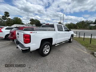 2018 Chevrolet Silverado 1500 LT with VIN 3GCUKREC4JG432719, listed as a Copart auction lot 52822625 with 161,100 mi miles and Clean Title. Bid and sale history available at carsss.com. Image 4.