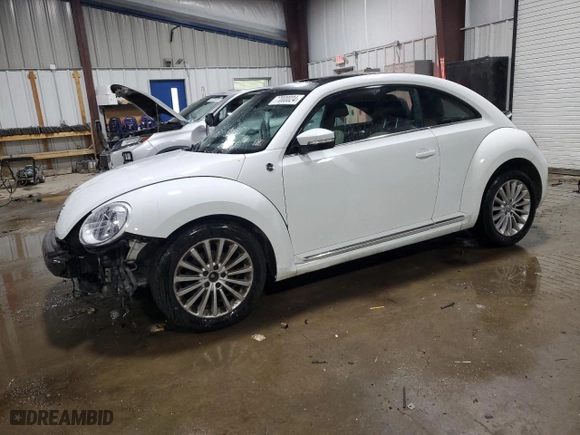 2019 Volkswagen Beetle S with VIN 3VWFD7AT4KM703324, listed as a Copart auction lot 77000024 with 93,346 mi miles and Salvage Title. Bid and sale history available at carsss.com. Image 1.