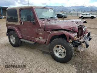 2002 Jeep Wrangler Sahara with VIN 1J4FA59S32P746410, listed as a Copart auction lot 56403075 with 147,968 mi miles and Salvage title. Bid and sale history available at DreamBid. Image 4.