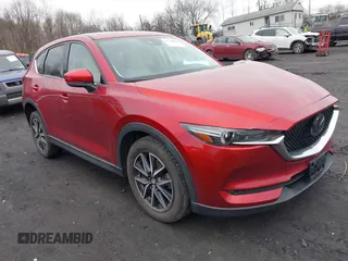 2018 Mazda CX-5 Grand Touring with VIN JM3KFBDM0J0427753, listed as a IAAI auction lot 41740838 with 69,683 mi miles and . Bid and sale history available at DreamBid. Image 1.