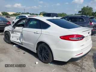 2020 Ford Fusion SE with VIN 3FA6P0HD3LR161093, listed as a IAAI auction lot 42127161 with 59,607 mi miles and . Bid and sale history available at DreamBid. Image 3.