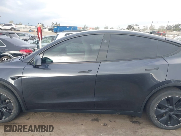 2024 Tesla Model Y with VIN 7SAYGDED8RF116209, listed as a IAAI auction lot 41761804 with 12,048 mi miles and . Bid and sale history available at DreamBid. Image 14.