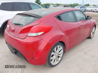 2013 Hyundai Veloster w/Gray Int with VIN KMHTC6AD2DU141462, listed as a IAAI auction lot 42136445 with 122,146 mi miles and . Bid and sale history available at DreamBid. Image 4.