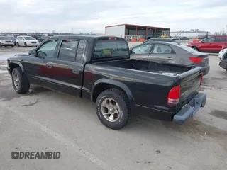2004 Dodge Dakota Sport with VIN 1D7HL38N24S768283, listed as a IAAI auction lot 41635910 with 328,505 mi miles. Bid and sale history available at carsss.com. Image 3.