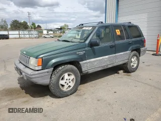 1993 Jeep Grand Cherokee Laredo with VIN 1J4GZ58Y8PC513026, listed as a Copart auction lot 57001465 with 135,242 mi miles and Clean title. Bid and sale history available at DreamBid. Image 1.