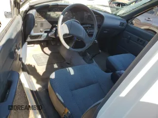 1991 Toyota Pickup DLX z VIN JT4VN13D4M5065504, wystawiony jako Copart lot #54058595 z przebiegiem 108 782 mil mil oraz Tytuł czysty. Historia ofert i sprzedaży dostępna na DreamBid. Obrazek 8.