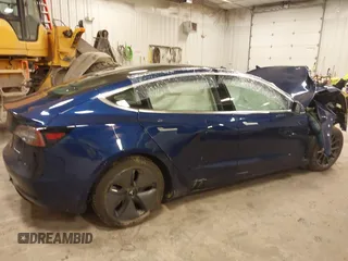2018 Tesla Model 3 Long Range Battery with VIN 5YJ3E1EB7JF086201, listed as a IAAI auction lot 41965193 with 99,231 mi miles and . Bid and sale history available at DreamBid. Image 13.