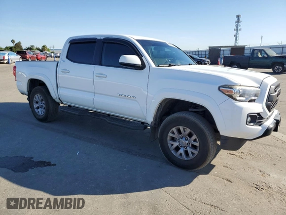 2017 Toyota Tacoma SR z VIN 5TFAX5GNXHX074690, wystawiony jako Copart lot #56672165 z przebiegiem 107 292 mil mil oraz Szkoda całkowita • Salvage title. Historia ofert i sprzedaży dostępna na DreamBid. Obrazek 4.