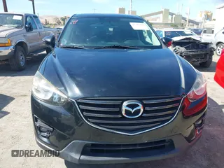 2016 Mazda CX-5 Touring z VIN JM3KE4CY2G0656270, wystawiony jako IAAI lot #42344489 z przebiegiem 60 449 mil mil oraz . Historia ofert i sprzedaży dostępna na DreamBid. Obrazek 13.