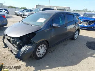2015 Toyota Yaris L with VIN VNKKTUD31FA027763, listed as a IAAI auction lot 41886803 with 104,889 mi miles. Bid and sale history available at carsss.com. Image 2.
