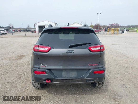 2016 Jeep Cherokee Trailhawk z VIN 1C4PJMBS4GW167650, wystawiony jako IAAI lot #41936549 z przebiegiem 218 000 mil mil oraz . Historia ofert i sprzedaży dostępna na DreamBid. Obrazek 16.