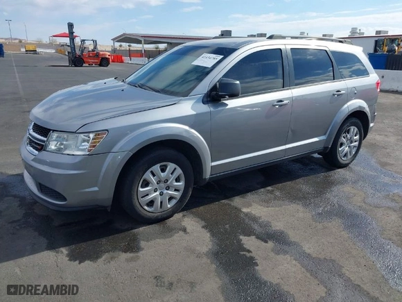 2016 Dodge Journey SE with VIN 3C4PDCAB0GT230512, listed as a IAAI auction lot 41434785 with 140,829 mi miles. Bid and sale history available at carsss.com. Image 2.