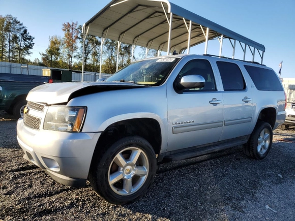 2014 Chevrolet Suburban LT with VIN 1GNSKJE76ER208747, listed as a Copart auction lot 74501524 with 196,971 mi miles and Salvage Title. Bid and sale history available at carsss.com. Image 1.