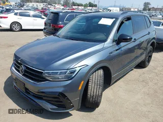 2023 Volkswagen Tiguan SE R-Line Black with VIN 3VVCB7AX8PM036684, listed as a IAAI auction lot 42169004 with 25,024 mi miles and . Bid and sale history available at DreamBid. Image 2.