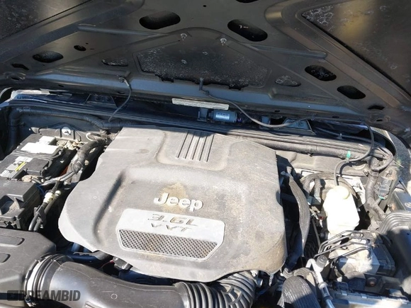 2012 Jeep Wrangler Unlimited Sport with VIN 1C4BJWDG5CL209978, listed as a IAAI auction lot 41662081 with 202,282 mi miles. Bid and sale history available at carsss.com. Image 10.