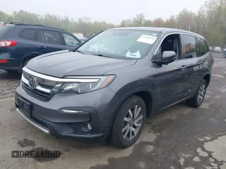2020 Honda Pilot EX-L with VIN 5FNYF6H5XLB024719, listed as a IAAI auction lot 42168150 with 90,933 mi miles and . Bid and sale history available at carsss.com. Image 2.