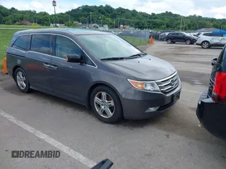 2013 Honda Odyssey Touring with VIN 5FNRL5H9XDB078601, listed as a IAAI auction lot 42516058 with 181,049 mi miles and . Bid and sale history available at DreamBid. Image 1.