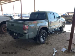 2023 Toyota Tacoma 4WD SR with VIN 3TMCZ5ANXPM613857, listed as a IAAI auction lot 41771957 with 76,232 mi miles. Bid and sale history available at carsss.com. Image 4.