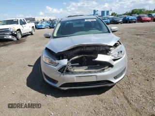 2017 Ford Focus SE z VIN 1FADP3F24HL308294, wystawiony jako Copart lot #56516265 z przebiegiem 80 431 mil mil oraz Szkoda całkowita • Salvage title. Historia ofert i sprzedaży dostępna na DreamBid. Obrazek 5.
