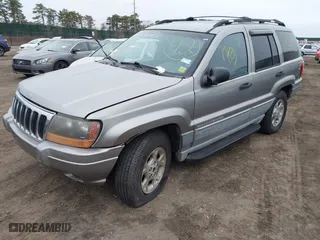 1999 Jeep Grand Cherokee Laredo with VIN 1J4GW58S9XC673310, listed as a IAAI auction lot 41927682 with 999,999 mi miles. Bid and sale history available at carsss.com. Image 2.