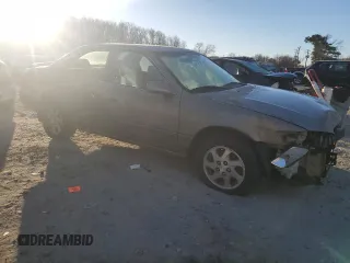 1999 Toyota Camry LE z VIN JT2BF22K0X0167589, wystawiony jako Copart lot #42699015 z przebiegiem 198 634 mil mil oraz Czysty tytuł • Clean title. Historia ofert i sprzedaży dostępna na DreamBid. Obrazek 4.