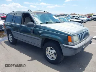 1993 Jeep Grand Cherokee Laredo with VIN 1J4GZ58S3PC637099, listed as a IAAI auction lot 42648307 with 292,753 mi miles and . Bid and sale history available at DreamBid. Image 1.
