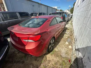 2014 Hyundai Elantra Coupe with VIN KMHDH6AH9EU025573, listed as a Copart auction lot 87049884 with 103,713 mi miles and Clean Title. Bid and sale history available at carsss.com. Image 4.