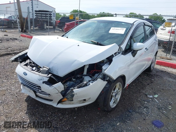 2018 Ford Fiesta SE z VIN 3FADP4EJXJM100407, wystawiony jako IAAI lot #42285374 z przebiegiem 90 261 mil mil oraz . Historia ofert i sprzedaży dostępna na DreamBid. Obrazek 17.