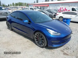 2021 Tesla Model 3 Performance with VIN 5YJ3E1EC1MF000961, listed as a IAAI auction lot 42110524 with 31,890 mi miles and . Bid and sale history available at carsss.com. Image 1.