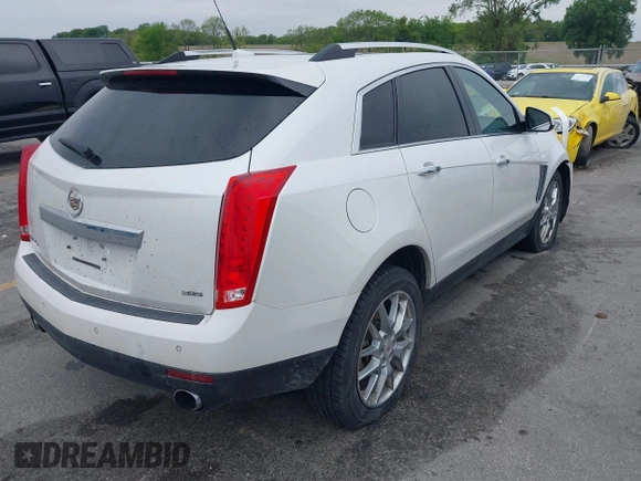 2013 Cadillac SRX Performance Collection z VIN 3GYFNHE35DS569528, wystawiony jako IAAI lot #42329652 z przebiegiem 97 184 mil mil oraz . Historia ofert i sprzedaży dostępna na DreamBid. Obrazek 4.