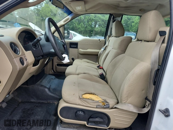 2007 Ford F-150 STX with VIN 1FTRX12W07NA02984, listed as a Copart auction lot 60305325 with 127,731 mi miles and Salvage title. Bid and sale history available at DreamBid. Image 7.