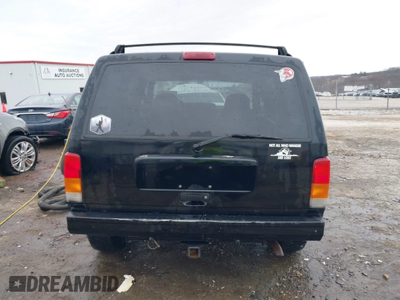1999 Jeep Cherokee Sport with VIN 1J4FT68S6XL598558, listed as a IAAI auction lot 41549504 with 238,004 mi miles. Bid and sale history available at carsss.com. Image 16.