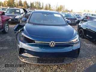 2023 Volkswagen ID.4 Pro z VIN 1V2DNPE81PC017620, wystawiony jako IAAI lot #41573053 z przebiegiem 15 462 mil mil oraz . Historia ofert i sprzedaży dostępna na DreamBid. Obrazek 13.