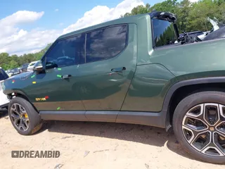 2023 Rivian R1T Adventure z VIN 7FCTGAAAXPN019894, wystawiony jako IAAI lot #42168226 z przebiegiem 23 380 mil mil oraz . Historia ofert i sprzedaży dostępna na DreamBid. Obrazek 15.