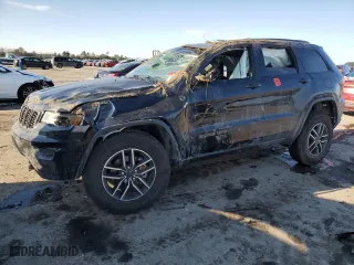 2019 Jeep Grand Cherokee Trailhawk with VIN 1C4RJFLG7KC823624, listed as a Copart auction lot 88843075 with 102,997 mi miles and Salvage Title. Bid and sale history available at carsss.com. Image 1.
