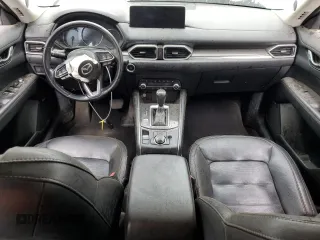 2021 Mazda CX-5 Grand Touring z VIN JM3KFADM7M1339081, wystawiony jako Copart lot #58913585 z przebiegiem Nie podano mil oraz Szkoda całkowita • Salvage title. Historia ofert i sprzedaży dostępna na DreamBid. Obrazek 8.