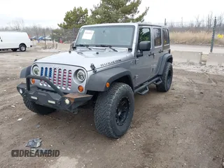 2013 Jeep Wrangler Unlimited Rubicon z VIN 1C4BJWFG7DL667083, wystawiony jako IAAI lot #42016912 z przebiegiem 148 933 mil mil oraz . Historia ofert i sprzedaży dostępna na DreamBid. Obrazek 2.