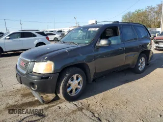 2004 GMC Envoy SLE with VIN 1GKDT13S042404250, listed as a Copart auction lot 52672455 with 230,610 mi miles and Salvage Title. Bid and sale history available at carsss.com. Image 1.