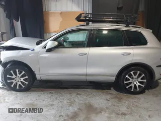 2011 Volkswagen Touareg Exec with VIN WVGFK9BP4BD005986, listed as a IAAI auction lot 41183877 with 109,005 mi miles and . Bid and sale history available at DreamBid. Image 14.