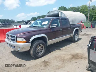 2004 Dodge Dakota SLT with VIN 1D7HG48NX4S649522, listed as a IAAI auction lot 42580132 with 124,037 mi miles and . Bid and sale history available at DreamBid. Image 2.