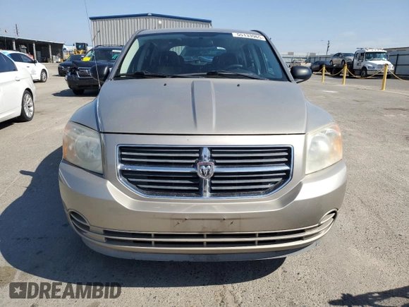 2009 Dodge Caliber SXT z VIN 1B3HB48A19D199410, wystawiony jako Copart lot #55133965 z przebiegiem 141 658 mil mil oraz Szkoda całkowita • Salvage title. Historia ofert i sprzedaży dostępna na DreamBid. Obrazek 5.