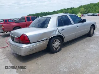 2004 Mercury Grand Marquis LS Premium z VIN 2MEFM75W74X664774, wystawiony jako IAAI lot #42111972 z przebiegiem 273 203 mil mil oraz . Historia ofert i sprzedaży dostępna na DreamBid. Obrazek 4.