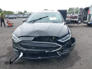 2018 Ford Fusion Titanium z VIN 3FA6P0K9XJR160993, wystawiony jako IAAI lot #41938148 z przebiegiem 137 410 mil mil oraz . Historia ofert i sprzedaży dostępna na DreamBid. Obrazek 12.