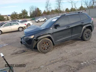 2022 Jeep Cherokee Trailhawk with VIN 1C4PJMBX0ND548397, listed as a IAAI auction lot 41240303 with 54,055 mi miles. Bid and sale history available at carsss.com. Image 2.