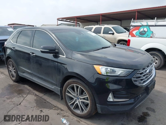 2020 Ford Edge Titanium z VIN 2FMPK3K92LBB24713, wystawiony jako IAAI lot #41949412 z przebiegiem 97 014 mil mil oraz . Historia ofert i sprzedaży dostępna na DreamBid. Obrazek 1.