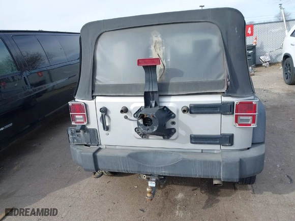 2010 Jeep Wrangler Unlimited Sport with VIN 1J4BA3H10AL112599, listed as a IAAI auction lot 41739263 with 156,301 mi miles. Bid and sale history available at carsss.com. Image 16.