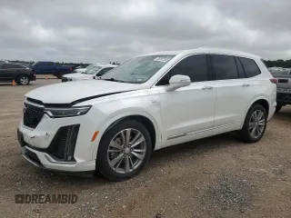 2022 Cadillac XT6 Premium Luxury z VIN 1GYKPFRS0NZ150862, wystawiony jako Copart lot #56197285 z przebiegiem 39 627 mil mil oraz Szkody całkowita. Historia ofert i sprzedaży dostępna na DreamBid. Obrazek 1.